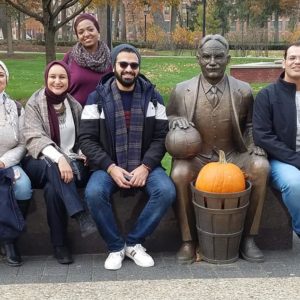 IVLP participants from Egypt pose with a statue of James Naismith