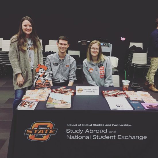 Photo of Oklahoma State University Staff at a booth at the Tulsa Global Alliance Study Abroad Fair
