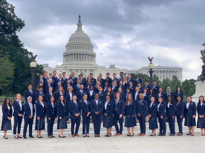Group of 75 Youth Ambassadors in navy blue uniforms in front of the US Capitol