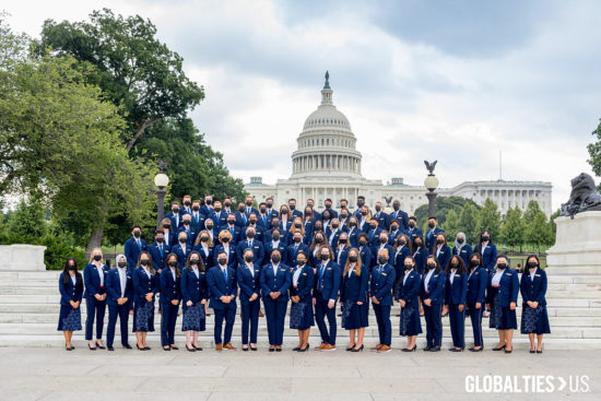 Group of 75 Youth Ambassadors in navy blue uniforms in front of the US Capitol