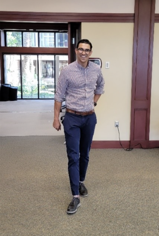 Man smiling at camera and standing up