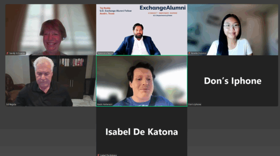 Zoom screen with 5 participants smiling on camera. 