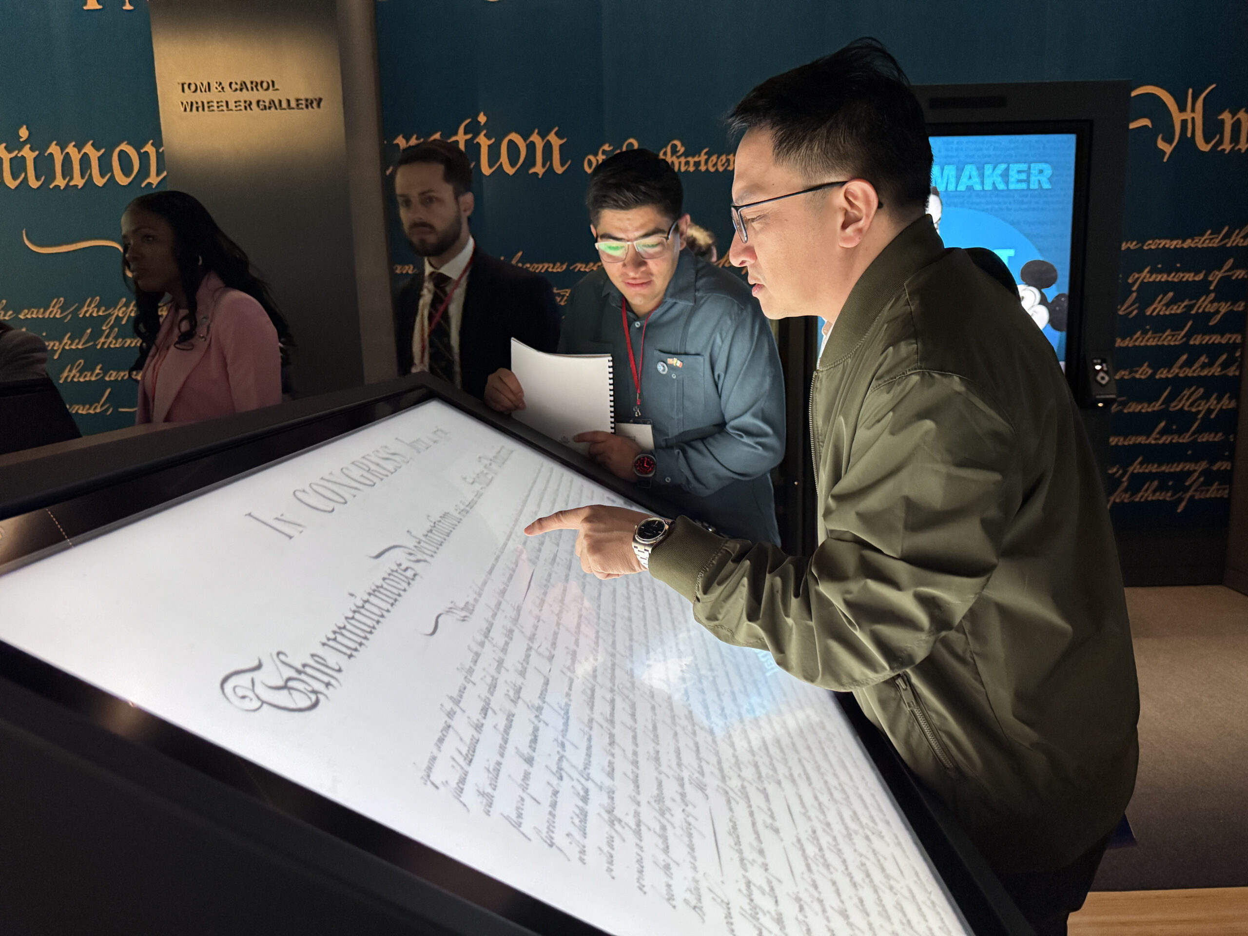 Man looks at electronic display of the U.S. Constitution.